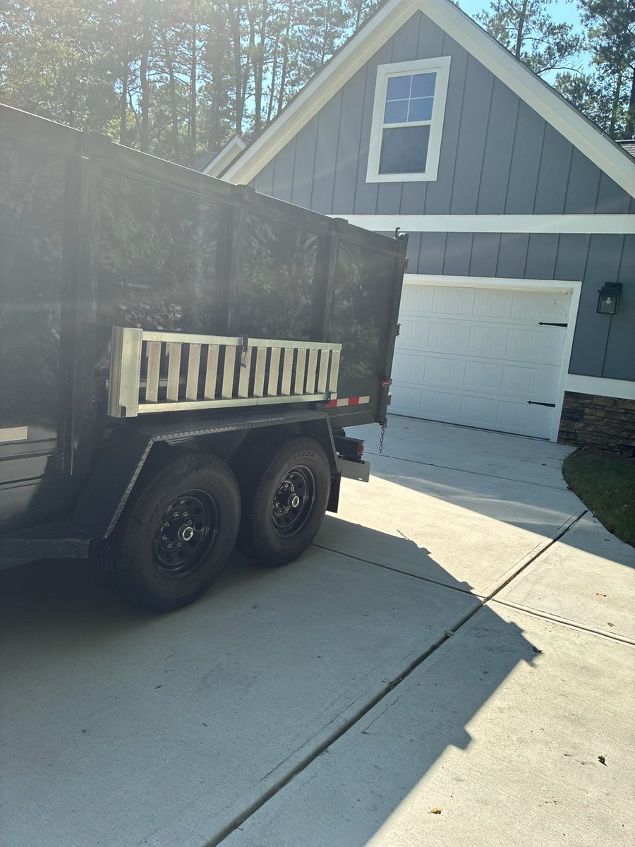 The Mason Worx dump trailer backed onto a driveway