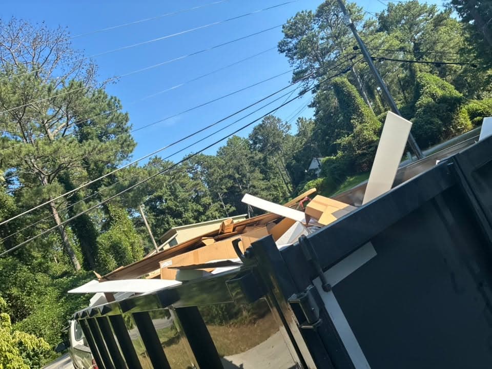 The Mason Worx dumpster trailer loaded at a job