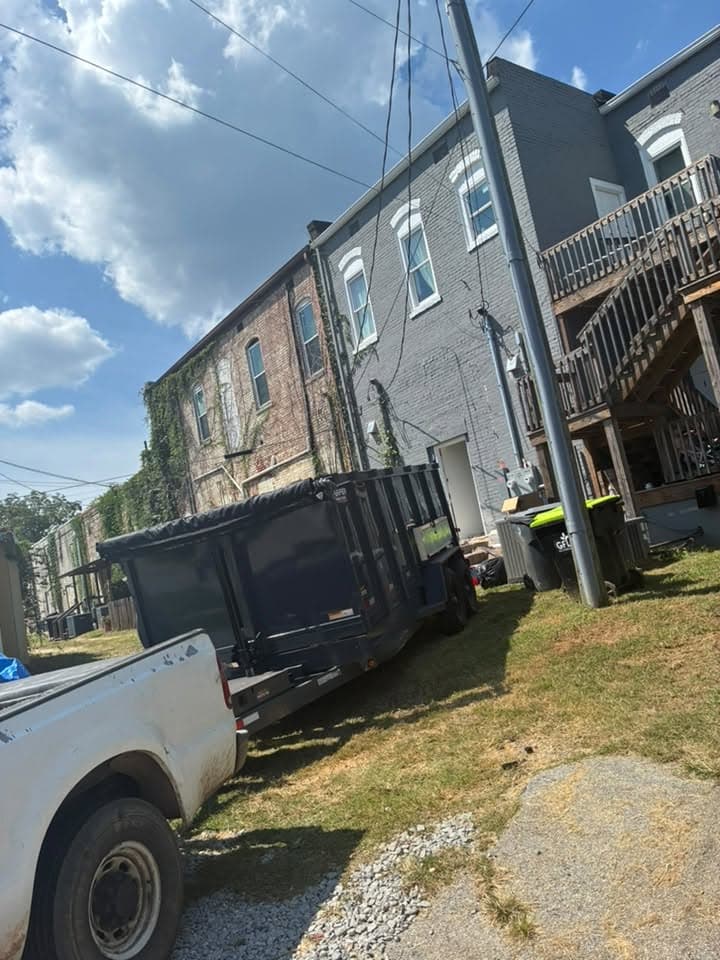 The dump trailer backed up to a townhouse for a cleanout